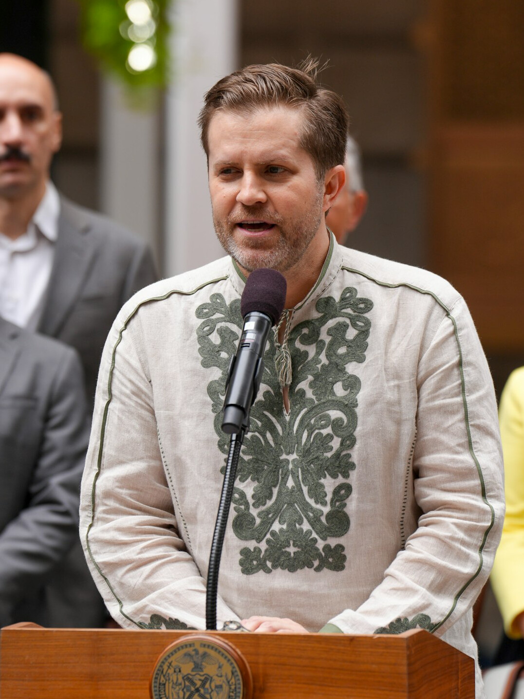 politician speaking at podium