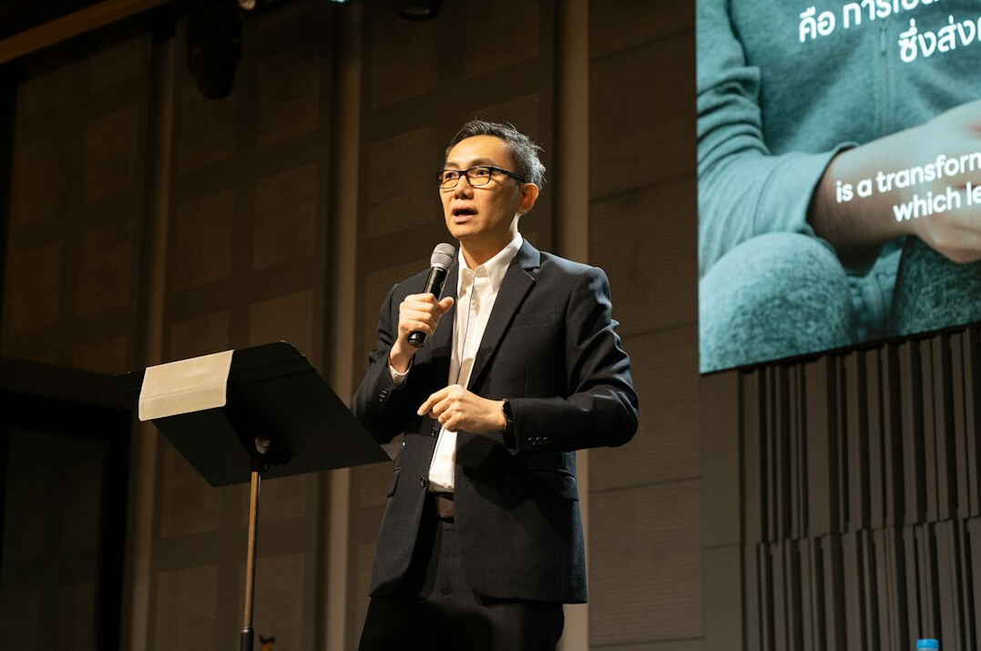 politician speaking at podium